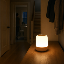 GlowRoam portable night light illuminating a quiet home hallway at night