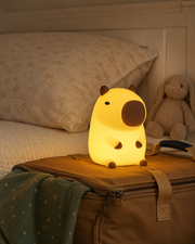 CapiZen capybara night light on an overnight bag at grandparents – image 4