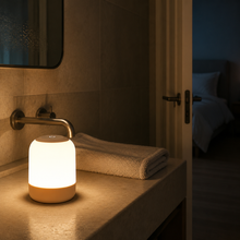 GlowRoam portable night light on a bathroom vanity at night
