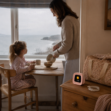 SunMoon pink sleep trainer in a coastal holiday cottage