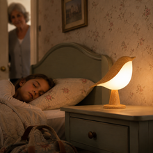 CalmBird bird night light comforting a child in a grandparents guest room