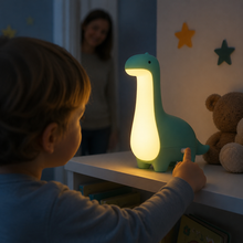Child touching the DinoDream dinosaur night light control