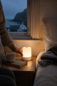 GentleLume portable lamp in a rainy UK cottage bedroom