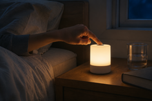 GentleLume touch lamp used beside a bed at night