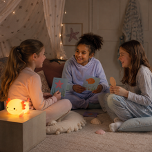 LumaAxo axolotl night light glowing during a children's sleepover
