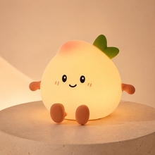 PeachLume peach-shaped kids night light glowing warmly
