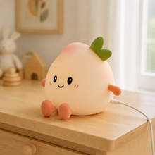 Rechargeable PeachLume night light connected to its charging cable