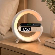WarmRise smart bedside lamp close-up with digital clock display and charging pad